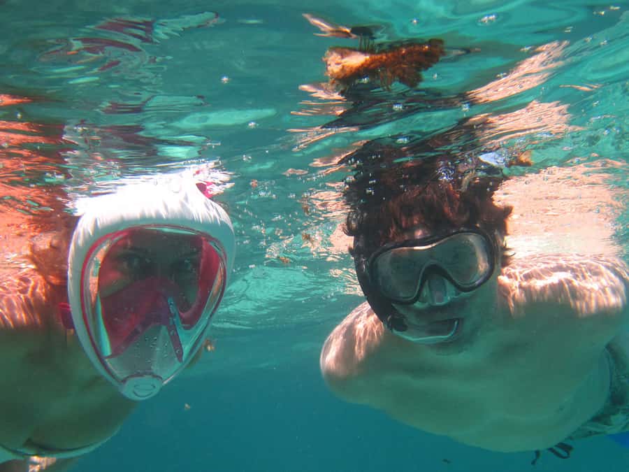 Blue Bay: Half-Day Snorkeling Trip with Creole Picnic Lunch - The glass-bottom boat and first coastal views