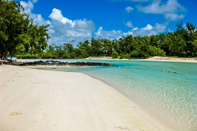 Catamaran to Ile aux Cerf with Parasailing, Tube Riding & Lunch - Parasailing above the Ile aux Cerfs lagoon