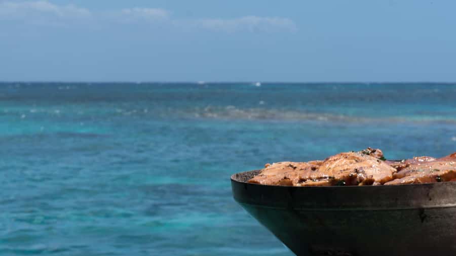 Full Day Catamaran Luxury Cruise to Northern Islands w Lunch - Passing Gunners Coin and its steep cliffs