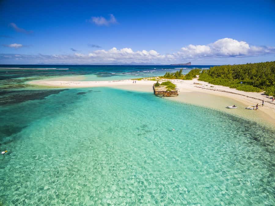 Grand Baie: Three Islands Private Boat Trip and Beach BBQ - Flat Island: sand, swimming, and the first taste of island life