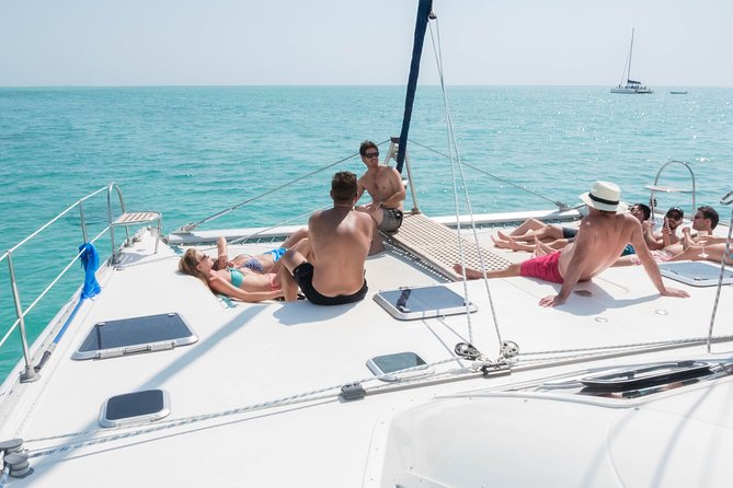 Sailing Catamaran Cruises - Snorkeling in clear lagoon water